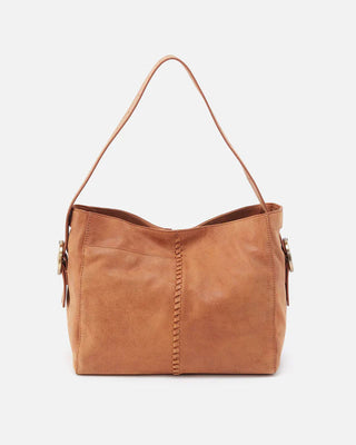 Brown leather handbag on a white background
