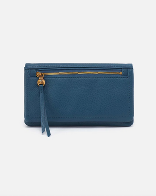 Blue wallet with a gold zipper on a light gray background