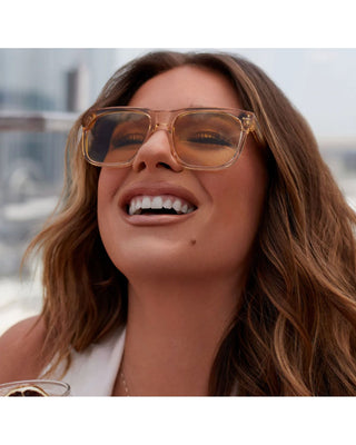 Woman wearing sunglasses with a blurred background