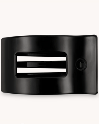 Black belt buckle with a central white stripe on a white background