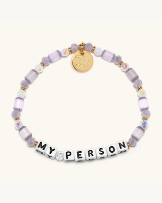Bracelet with purple beads and 'MY PERSON' charm on a white background
