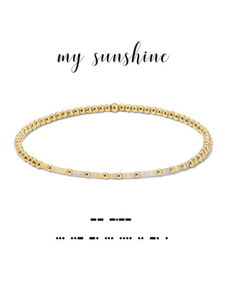 Gold beaded bracelet with 'my sunshine' text on a white background