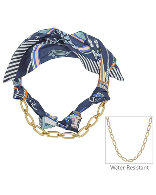 A navy blue patterned scarf styled as a necklace with a chunky gold chain link, shown on a white background with a small inset showing a plain gold chain and the text 'Water-Resistant'.