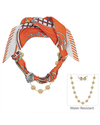 An orange silk scarf styled as a necklace with gold-toned pearl-like beads, shown on a white background. A small inset at bottom right shows a matching gold beaded necklace and earrings with the text 'Water-Resistant'.