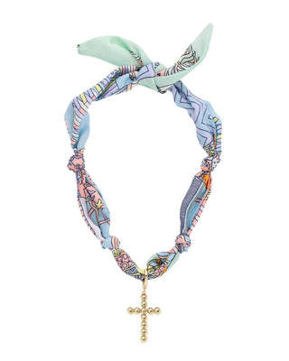 Colorful patterned scarf necklace with a gold cross pendant on a white background