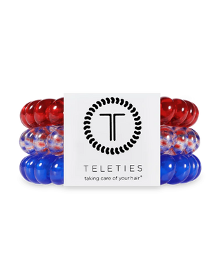 Red and blue hair ties with Teleties packaging on a white background