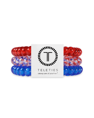 Set of red, white, and blue hair ties with a Teleties branded card on a white background