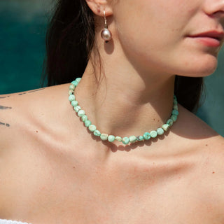Tula Blue Peruvian turquoise pebble necklace worn close to the neck.