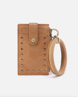 Brown leather wallet with keychain on a white background