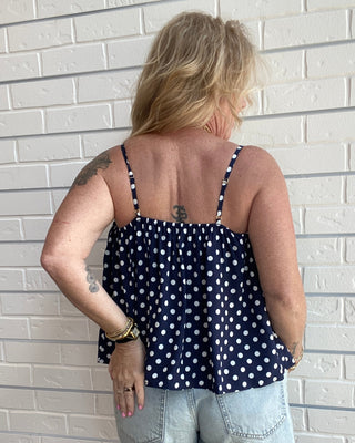 Women's navy and white polka dot tank top with spaghetti straps, an open neckline, and a relaxed fit back picture
