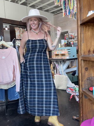 woman modeling flannel maxi dress and hat