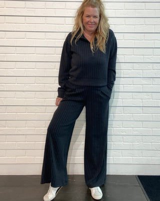 cropped raglan jacket with a quarter zipper and ribbed trim.