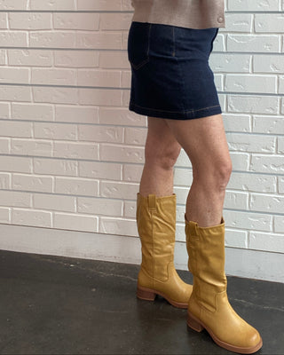Z Supply Socialite Denim Mini Skirt in Midnight Air. A dark indigo stretch denim mini with five pockets and classic gold hardware.