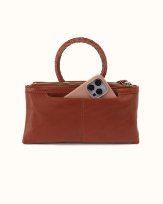A crossbody and clutch in one, designed for every day and everywhere. Inspired by our best-selling Sable wristlet, this crossbody has the signature round handle.