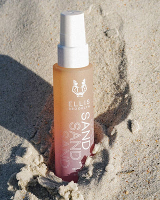 Ellis Brooklyn Sand & Sand perfume bottle on sand