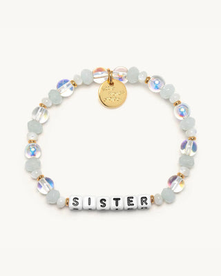 Bracelet with 'SISTER' beads and gold accents on a white background