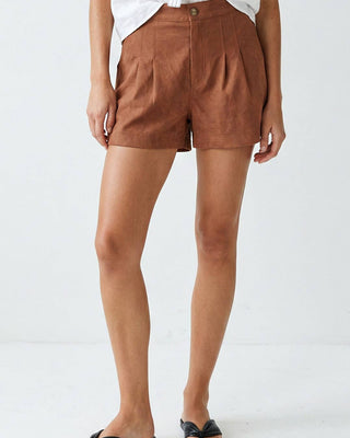 Person wearing brown shorts on a white background