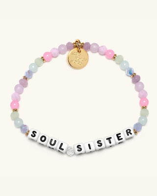 Multicolored beaded bracelet with 'Soul Sister' charm on a white background