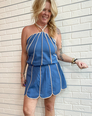 Women's slate blue linen blend skort with cream shell panel trim, built-in shorts, and a flattering tailored silhouette.