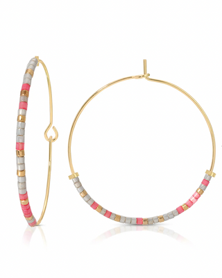 Hoop earrings with colorful beads that spell out survivor in morse code on a white background