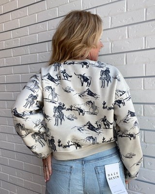 soft sponge fleece sweatshirt with a relaxed boxy fit and western-inspired graphic.
