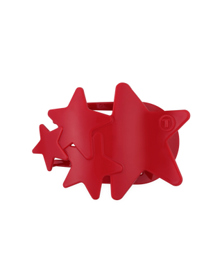 Red star-shaped hair clip on a white background