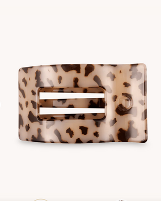 Leopard print hair clip on a white background