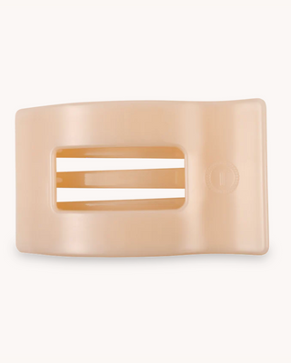 Beige hair clip on a white background