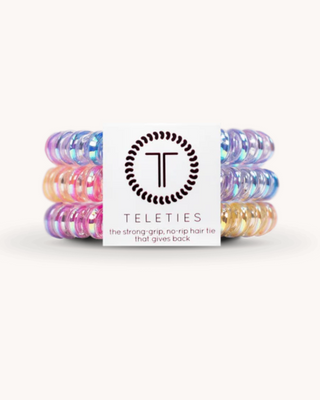 Set of colorful hair ties with a Teleties branded card on a white background