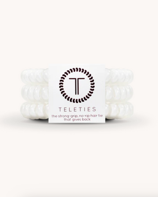 White hair ties with Teleties branding on a white background