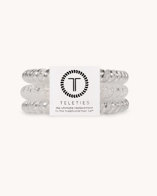 Set of silver hair ties with a Teleties label on a white background