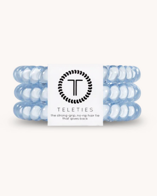 Set of blue hair ties with Teleties logo and branding on a white background