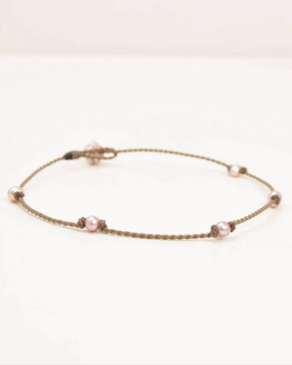 blush pearl anklet on white background