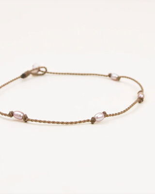 Bracelet with pearls on a white background