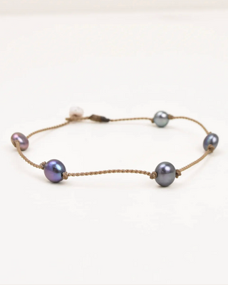 Anklet with pearls on a white background