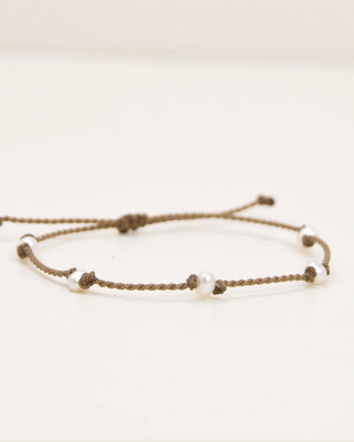 Bracelet with small beads on a light background