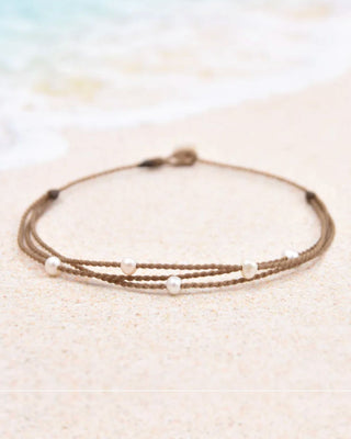 Multistrand bracelet with beads on a light background