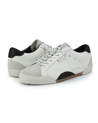 Pair of white sneakers with black accents on a white background