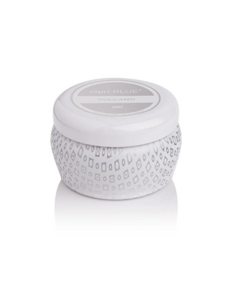 White candle container with decorative pattern on a white background