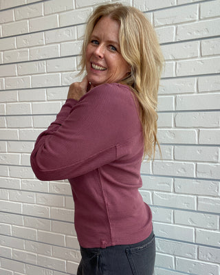Long Sleeve in a washed burgundy, a textured cotton thermal with a flattering boat neckline and relaxed dolman sleeves.