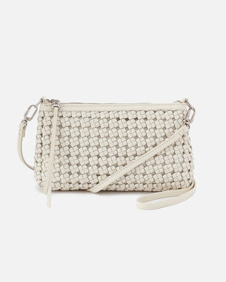 Woven beige handbag with a strap on a white background