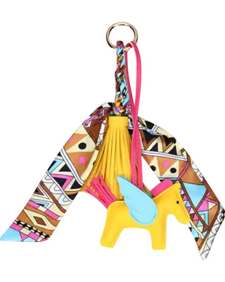 Colorful keychain with geometric pattern and yellow character on a white background