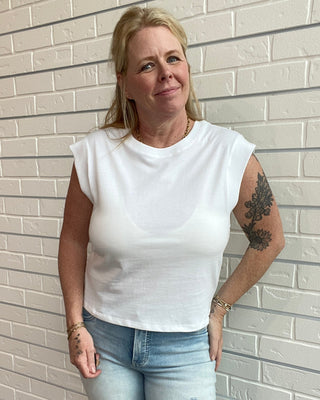woman wearing a white crop cap shoulder baby tee